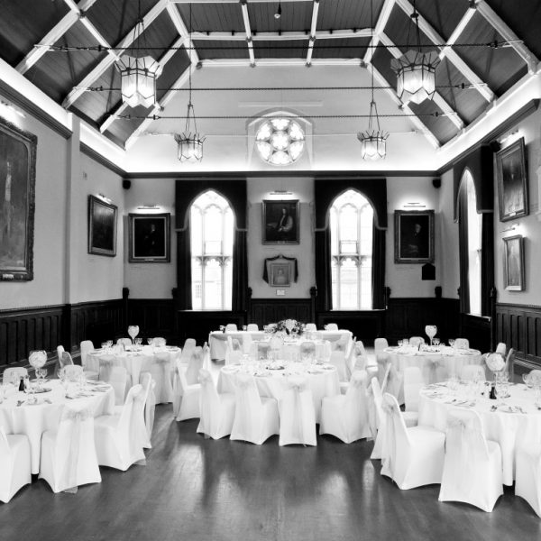 Grand main hall set for a wedding reception in black and white