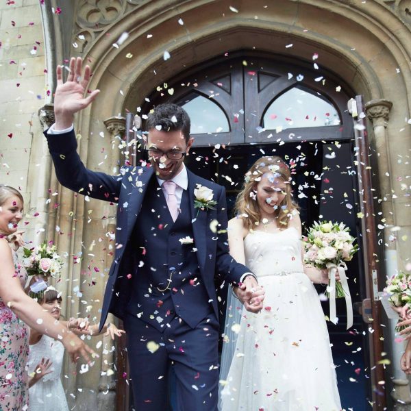 Confetti wedding couple leaving town hall