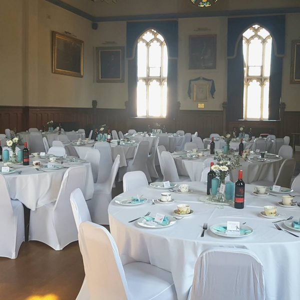 Dinner tables set up in grand main hall