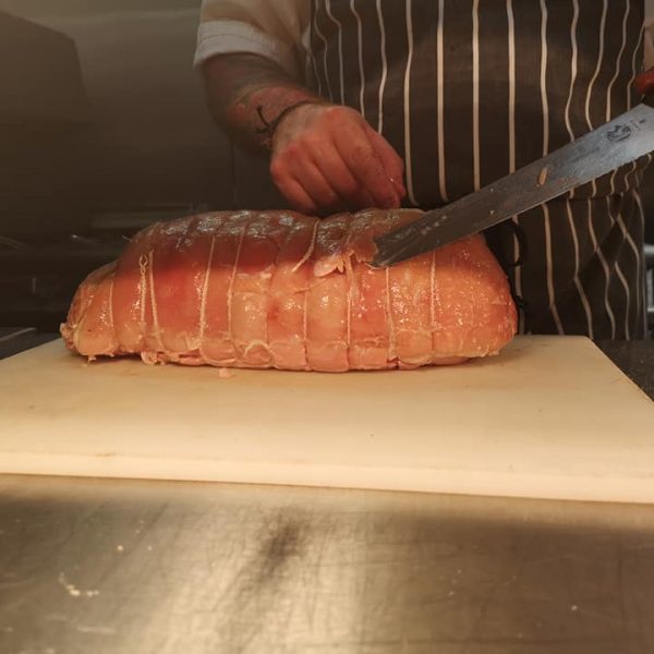 Chef preparing gammon joint